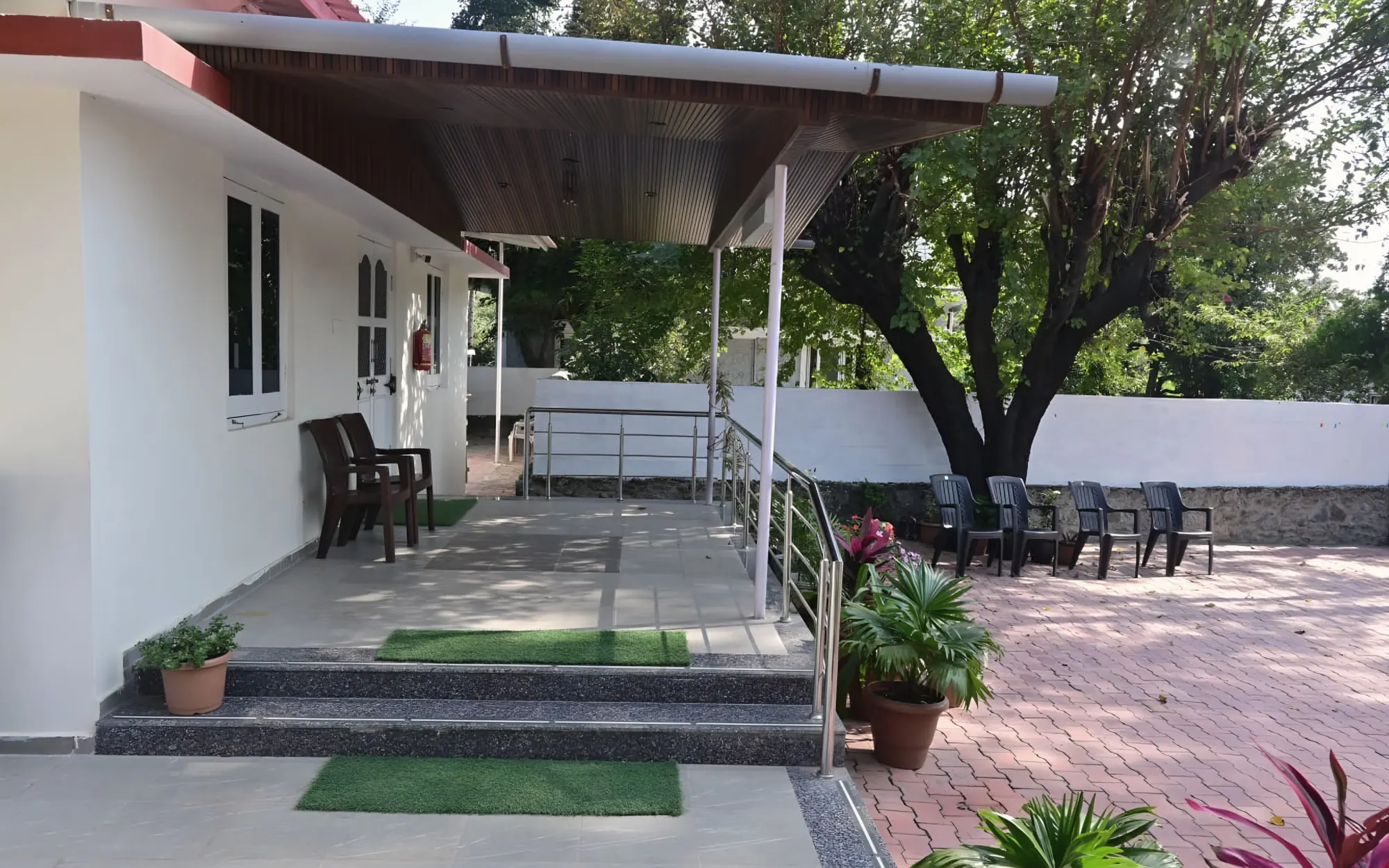 Shaded veranda looking onto the paved courtyard